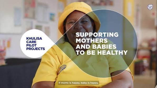 A community health worker in a yellow uniform beside the words “Khulisa Care Pilot Projects. Supporting mothers and babies to be healthy.”